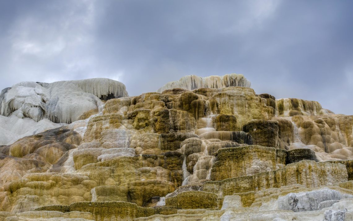 Mountainous Mineral Deposits At Yellowstone. The Calcium And Min