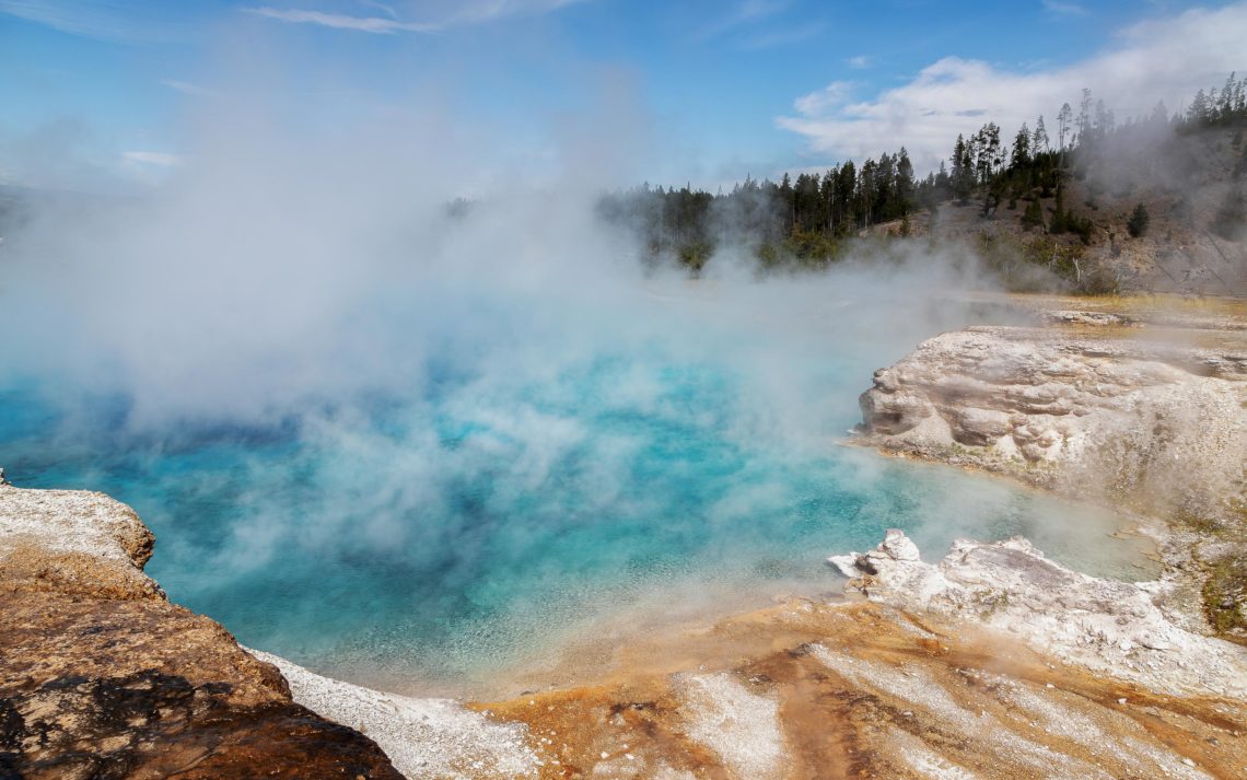 Steam Rises From A Pool At Grand Prismatic Spring In Yellowstone