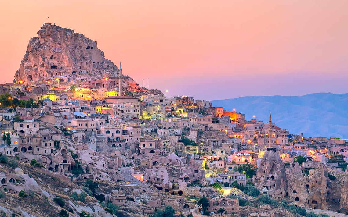 Uchisar Cave City In Cappadocia, Turkey On Sunset