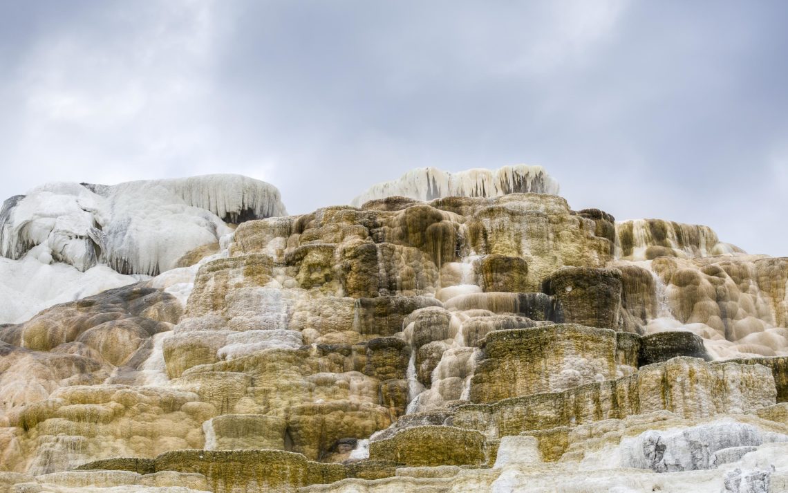 Mountainous Mineral Deposits At Yellowstone. The Calcium And Min