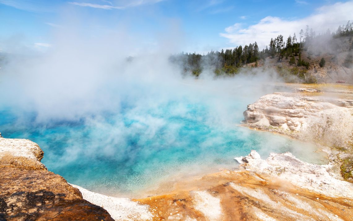 Steam Rises From A Pool At Grand Prismatic Spring In Yellowstone