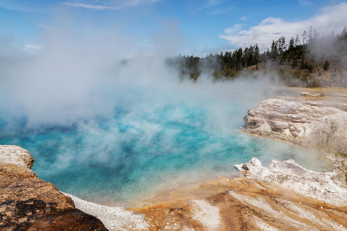 Steam Rises From A Pool At Grand Prismatic Spring In Yellowstone
